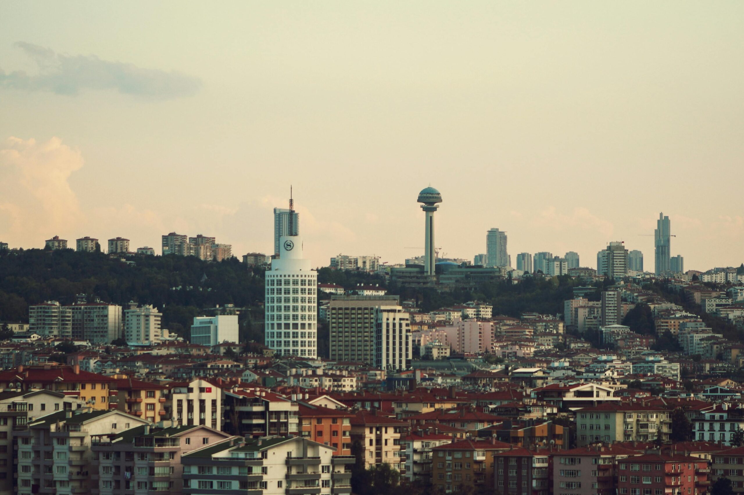 A vibrant cityscape of Ankara with the iconic Atakule Tower under a serene sky.